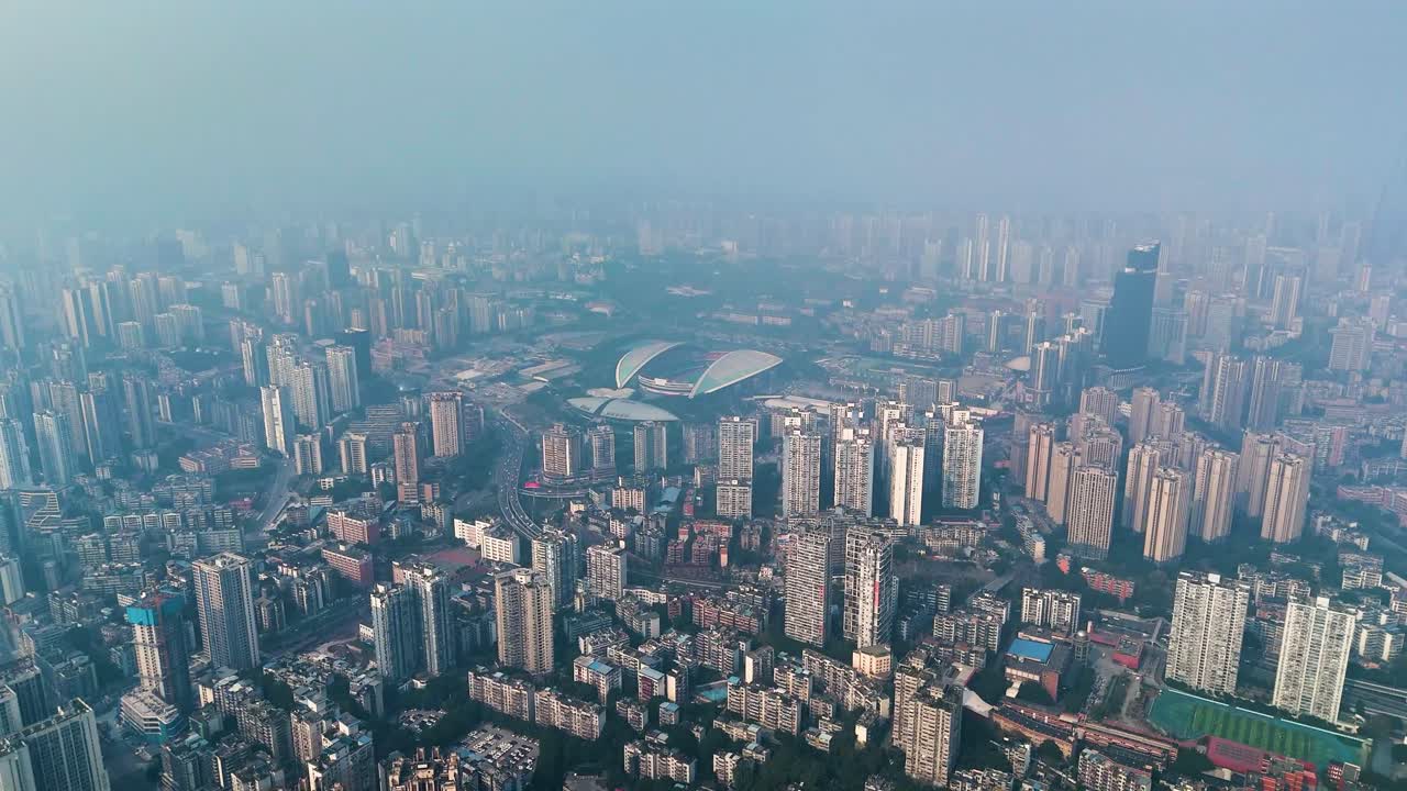 Aerial: Chongqing cityscape with extreme pollution during the day in Yuzhong District, China, establishing drone shot