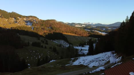Idyllic-snowy-hills-at-sunset-in-the-Bavarian-Alps-in-winter-in-Germany,-close-to-Austria