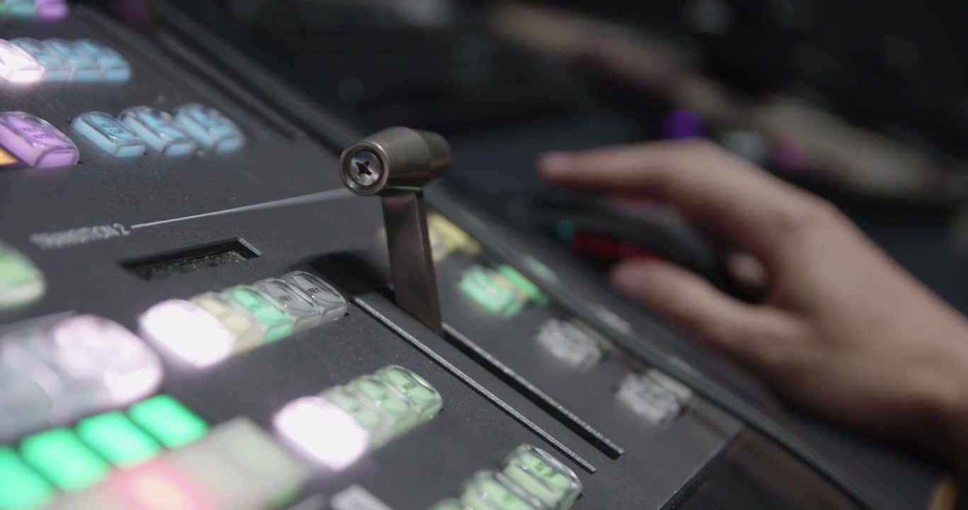 Someone pulling a lever on a control panel.