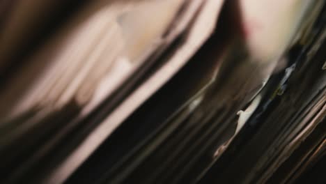 hand searching old air mail correspondence close-up in moody shadows