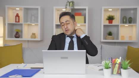 home office worker man loosening his tie from stress.