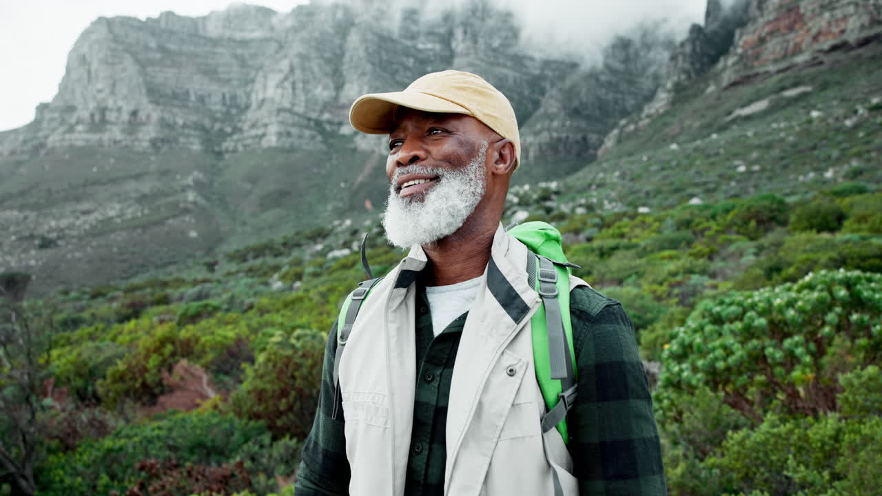 Older man hiking in the mountains