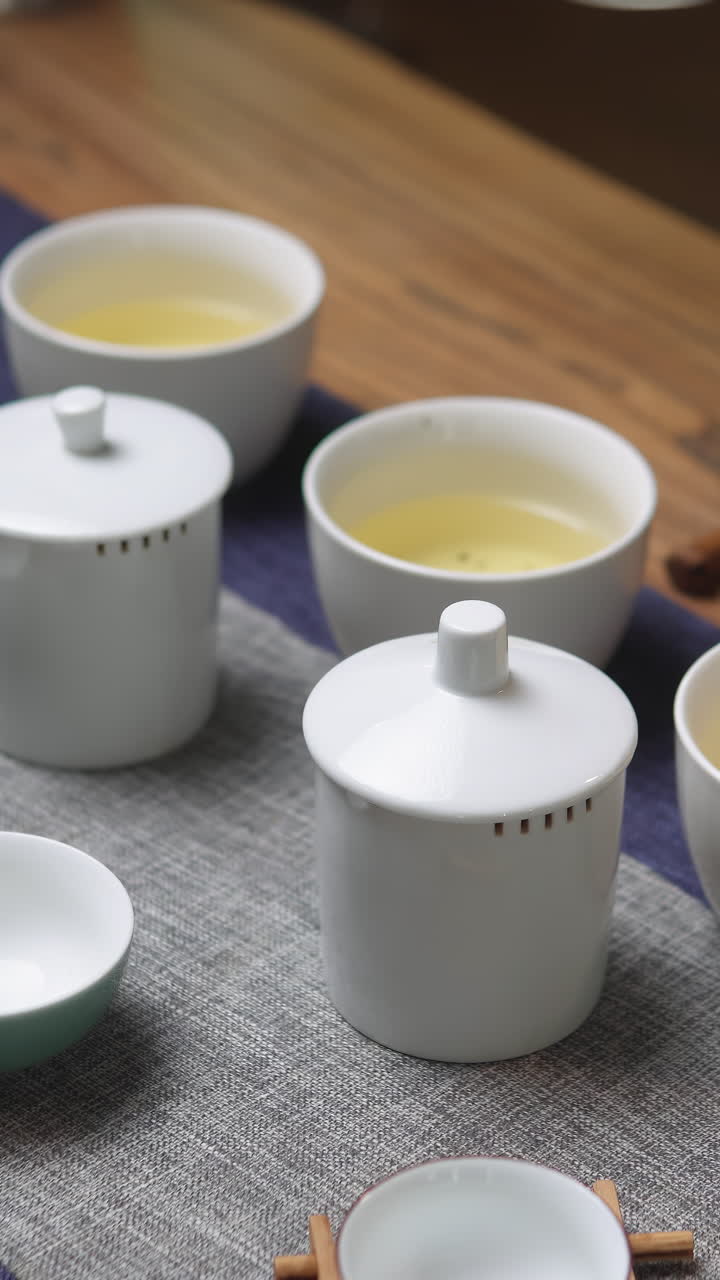 Tea Ceremony Setup with White Ceramic Cups