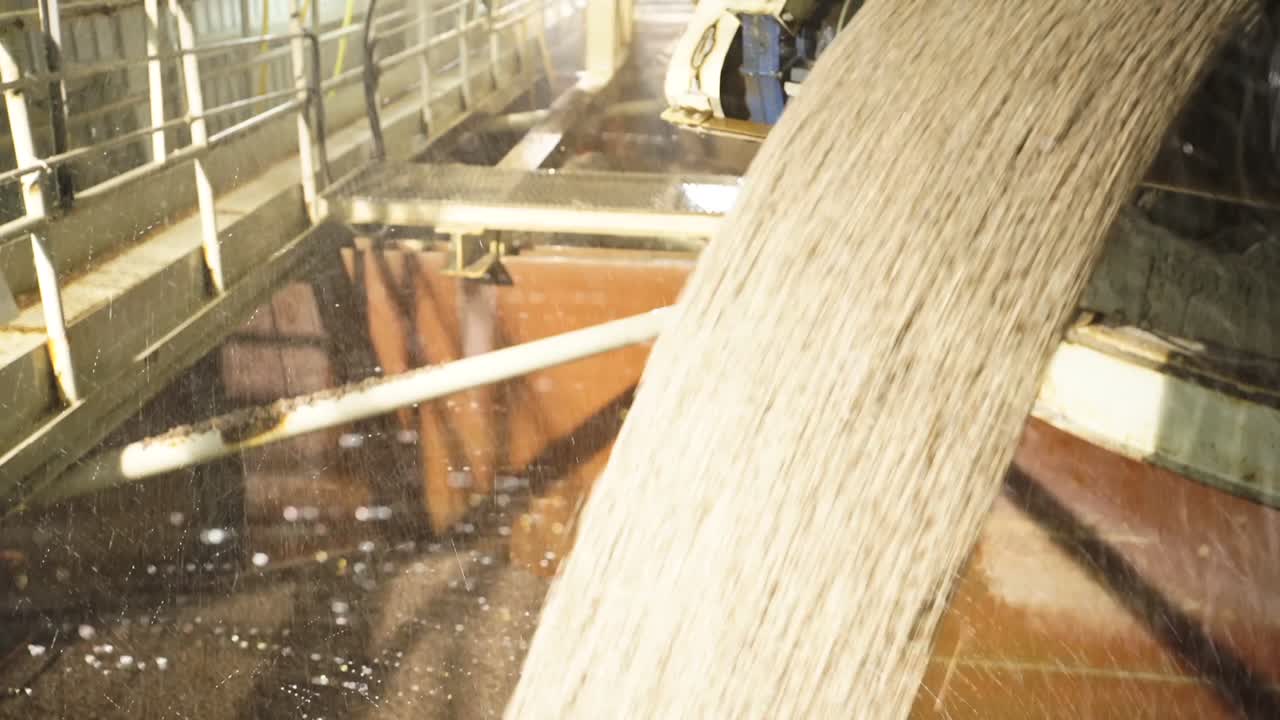 Cement Clinker From Conveyor Belt Hydrated With Water In Cement Plant. close up