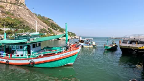 colorful boats moored in a calm coastal inlet