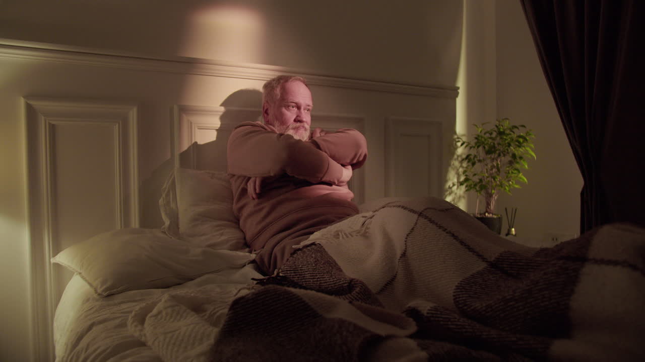 Old man trying to sleep