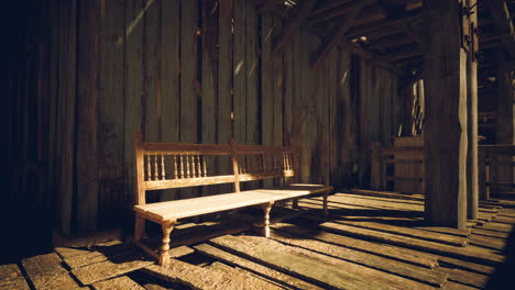 a rustic interior with a wooden bench and wooden floor