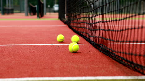 tennis balls hitting the net