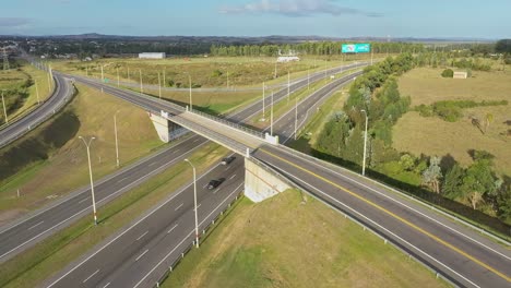 aerial shot of highway bridge junction interchange crossing road