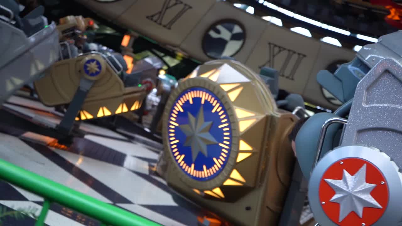 Rotating journey inside colorful time capsule ride at Tivoli Gardens amusement park, Copenhagen, Denmark, close up slow motion