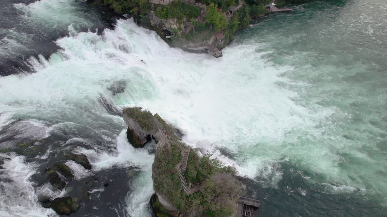 Drone shot of a huge water stream at Rhine Falls, Schaffhausen, Switzerland