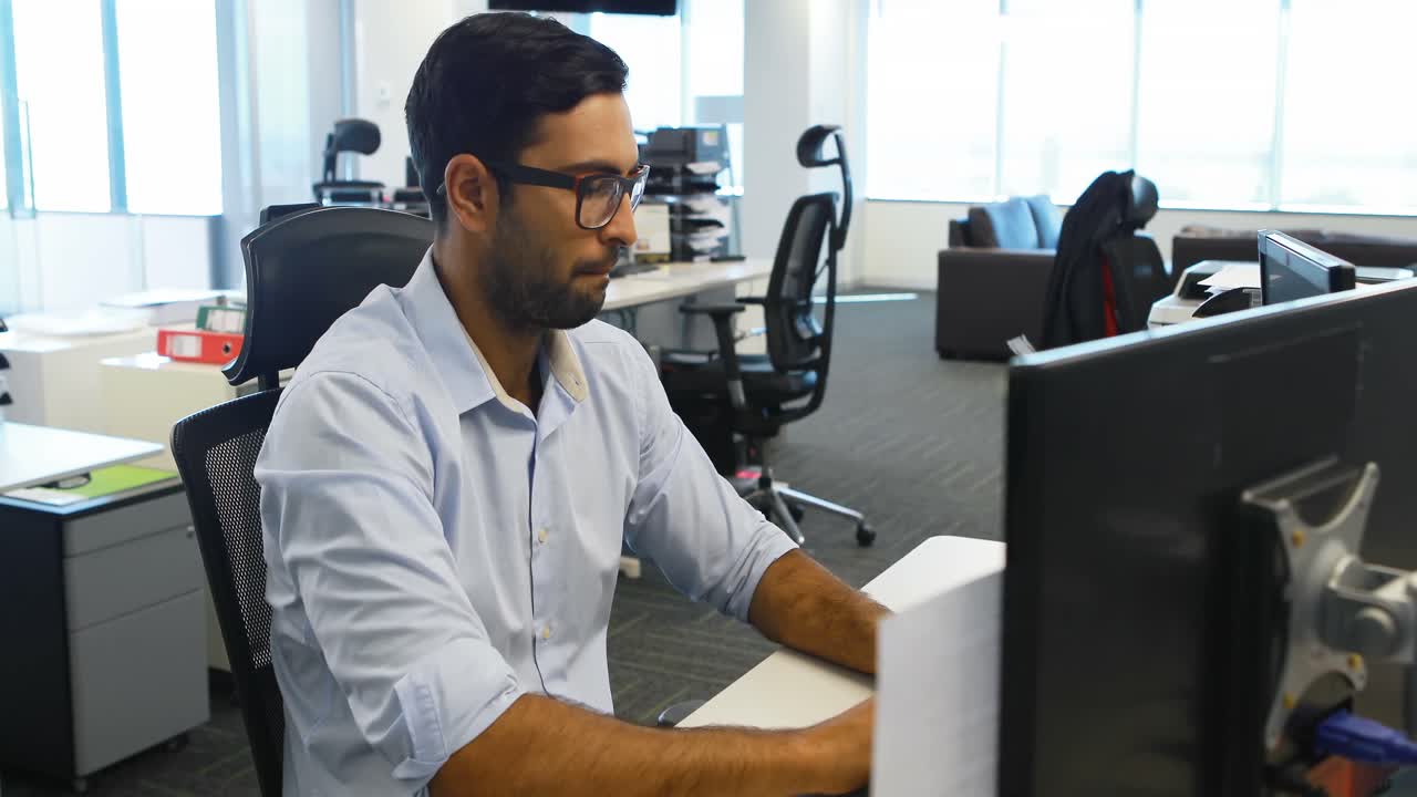 Male executive working on computer