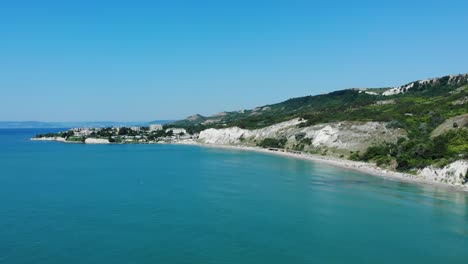 scenic view of blue water lagoon in balchik, bulgaria at daytime - aerial drone shot