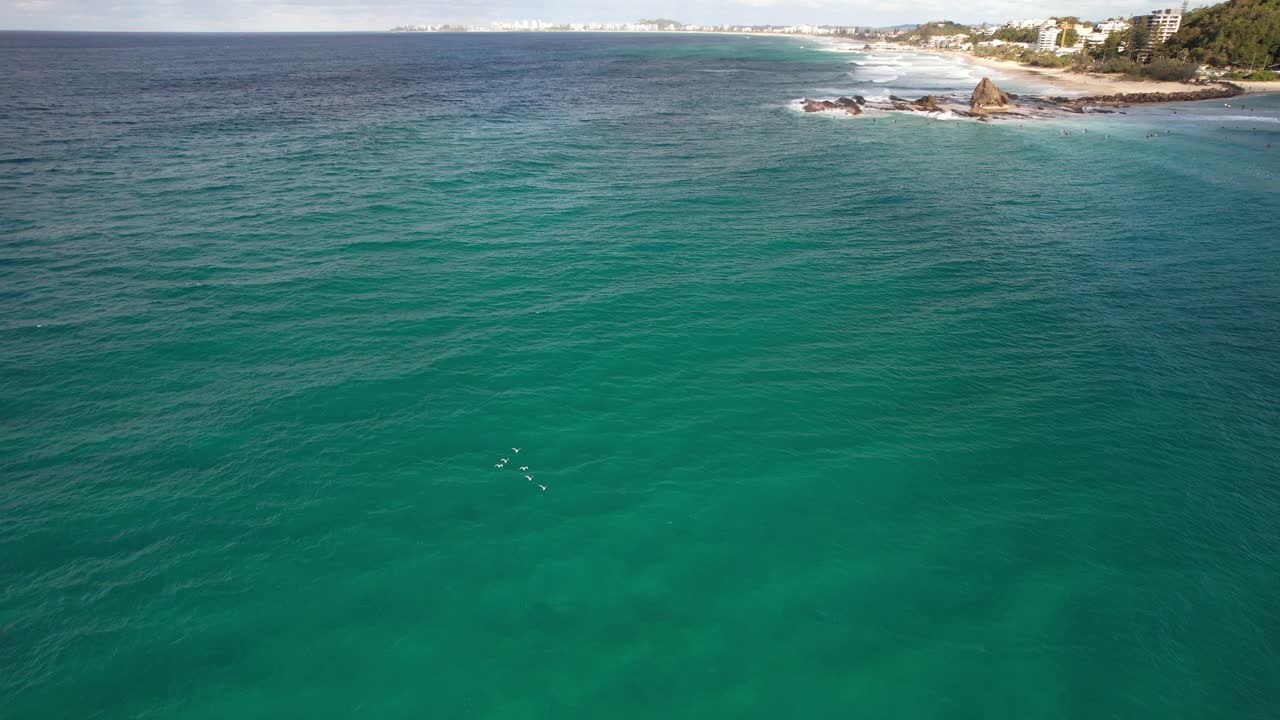 Flyover Blue Sea Near Currumbin Rock Surfing Spot In Queensland, Australia. Aerial Drone Shot