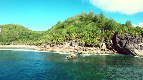 Mahe-Seychelles-reveal-shot-of-untouched-nature-of-the-south-west-coast-of-Mahe-island,-2-beaches-can-be-seen-in-the-shot