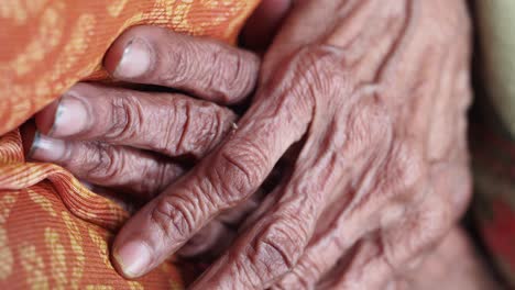close-up of wrinkled hands of an elderly woman