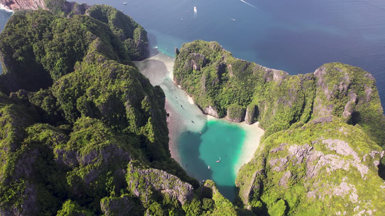 Aerial 4k top-down drone view of Phi Phi Leh, Pileh Lagoon, Krabi province, Thailand. Amazing tropical island with clear turquoise water during a low tide , famous travel destination.