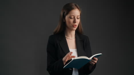 businesswoman reading a notebook