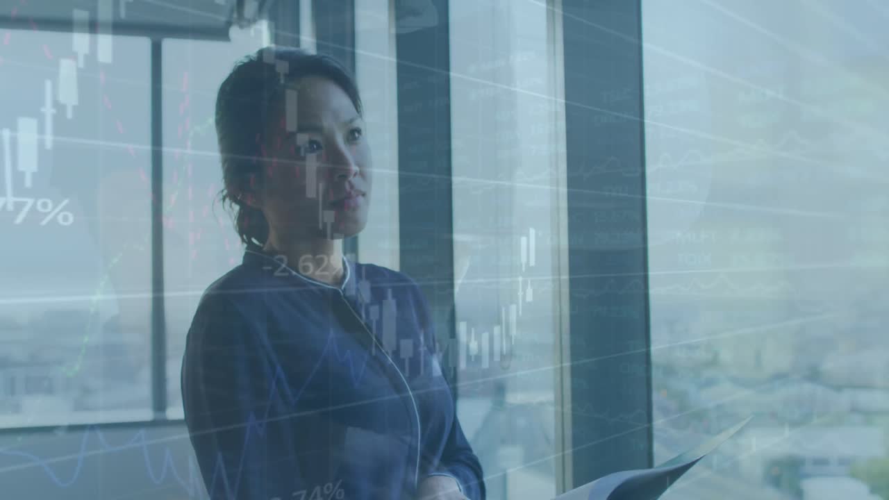 Animation of financial data processing over asian businesswoman working at office