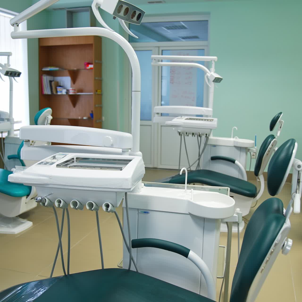 Light big study at dentist school for future stomatologists. Room with usual furniture and dentist's chairs for students' practice