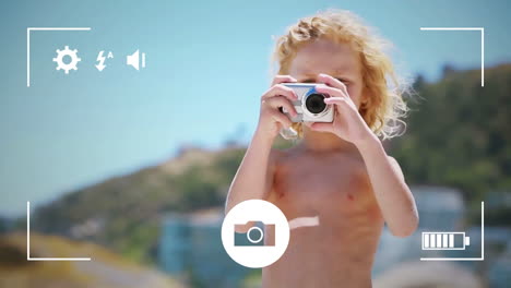 Taking-photos-of-child-on-digital-camera