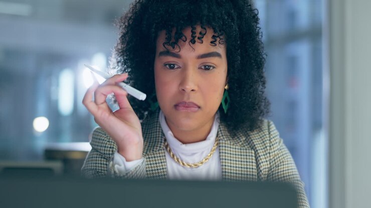 Business woman, laptop and thinking