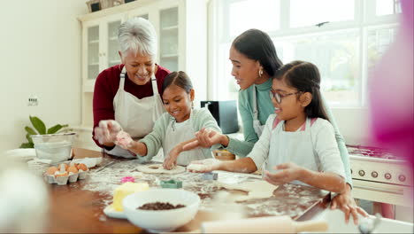 grandmother, mom and girls in a kitchen