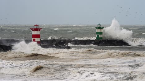 powerful waves crashing against a pier with lighthouses