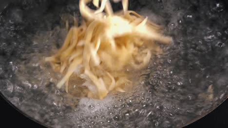 fresh pasta added to boiling water