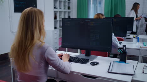 woman working on a computer in an office