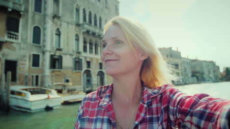 pov woman taking a selfie in venice