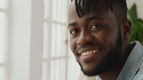 portrait of a man at home smiling