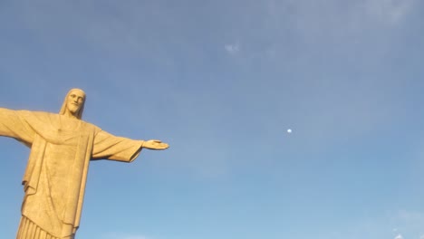 christ the redeemer is an art deco statue of jesus in rio de janeiro, brazil drone aerial close up against blue sky