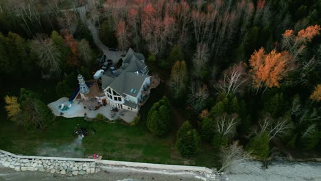 aerial of a blue vacation home from wisconsin usa filmed on autumn