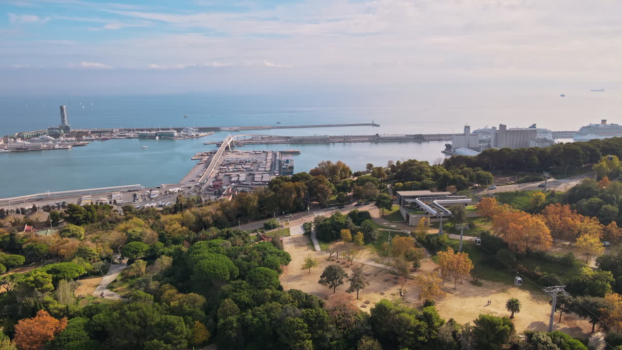 Aerial drone view of Barcelona city sea coastline with port. Sunny day. Montjuic district. Spain