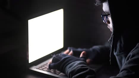 person working on a laptop at night