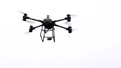 Delivery-drone-hover-in-air-and-pull-in-retractable-cable-using-winch-system