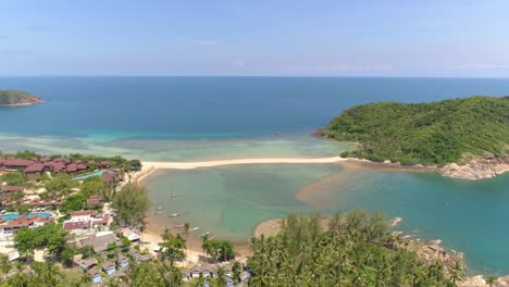 aerial view of a tropical beach with clear water and white sand