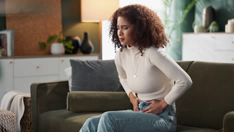 woman experiencing abdominal pain