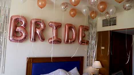 Decorations-and-balloons-for-the-bride's-room---camera-tilt-down