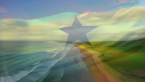 Animación-De-La-Bandera-De-Ghana-Ondeando-Sobre-El-Paisaje-Marino-De-La-Playa.