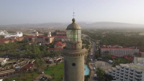 Tourist-town-coast-with-lighthouse-aerial-of-Gran-Canaria