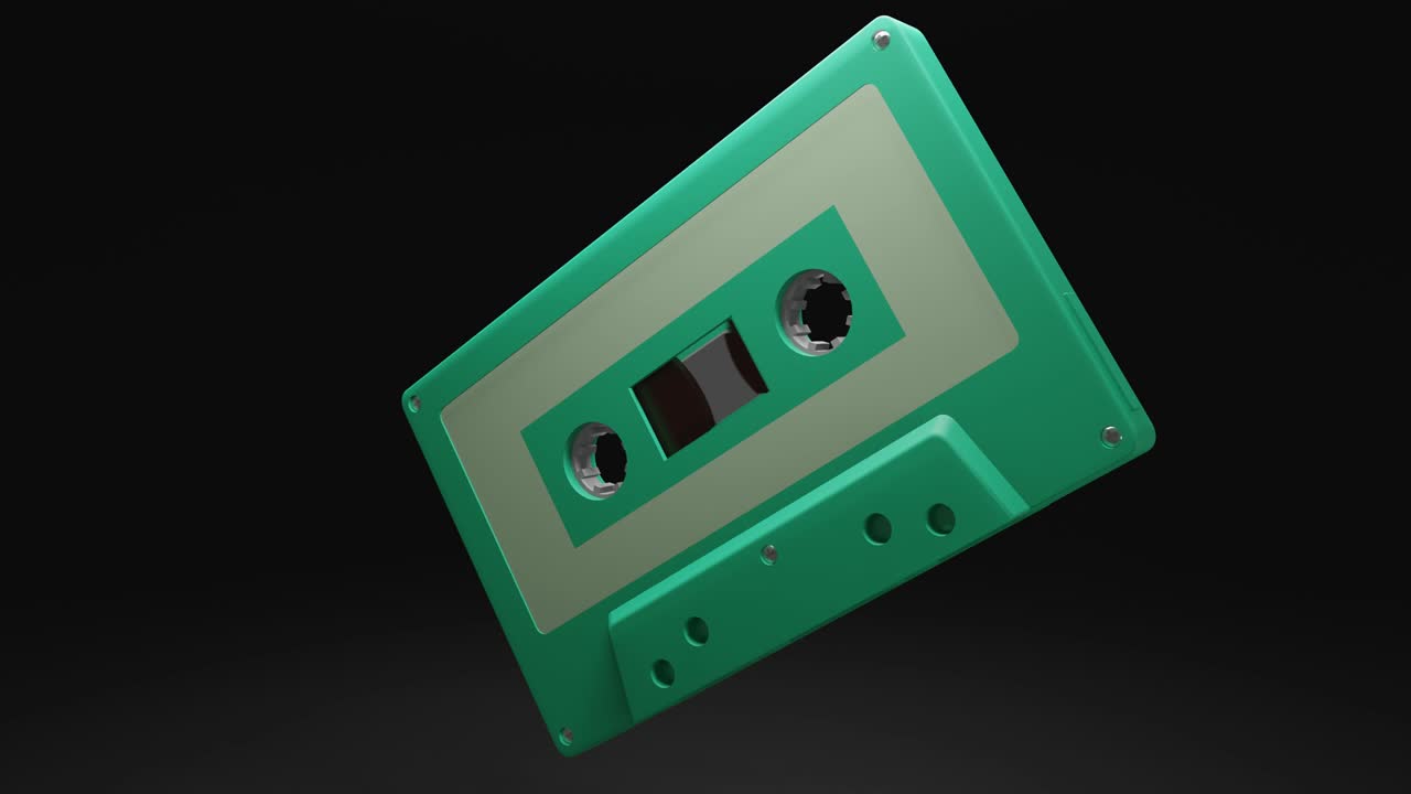 cinta de cassette verde pálido aislado en fondo negro. loop capaz de animación 3d.