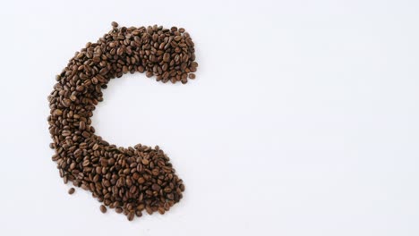 coffee beans forming alphabet c