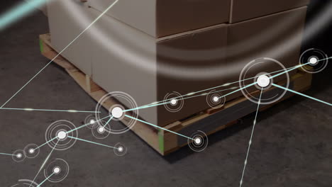 animation of network of connections over boxes in warehouse