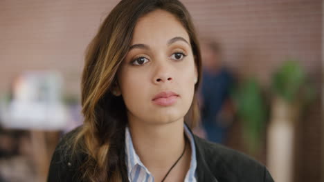 portrait-of-bored-young-hispanic-woman-looking-pensive-contemplative-in-office-workspace