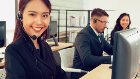 business people wearing headset working in office