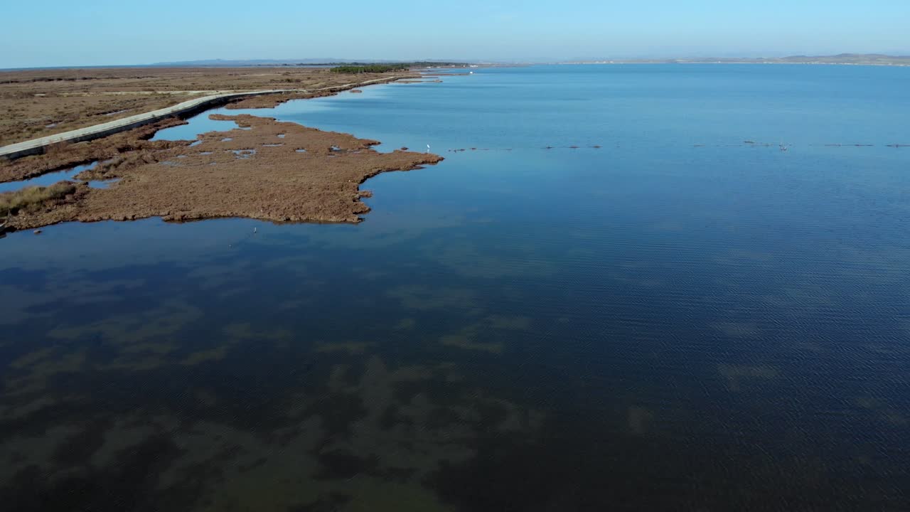 Beautiful natural lagoon, ideal environment for migratory birds to built nests on dry reeds surrounded by calm clear water