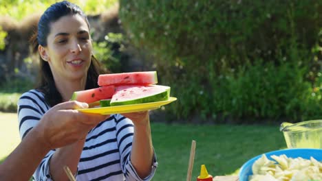 Multi-generation-family-having-breakfast-in-park-4k