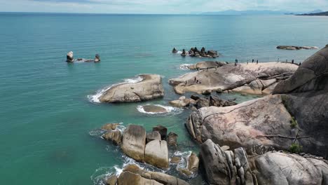 rocky harbor shore of koh samui island groups in thailand with clear turquoise seawater